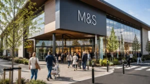 Large modern M&S store with shoppers entering and trolleys outside